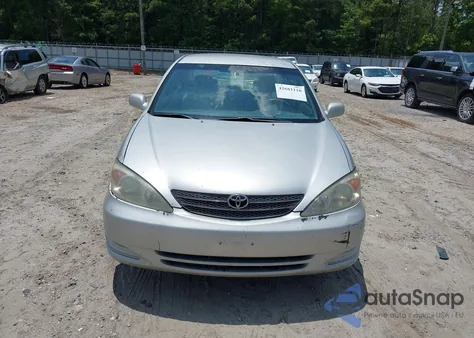 2003 Toyota Camry Le z USA, uszkodzony, nr VIN 4T1BE32KX3U698653